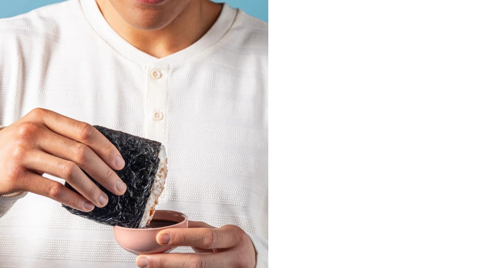Sushi-inspired rice pocket filled with salmon and fresh ingredients, showing its handheld format
